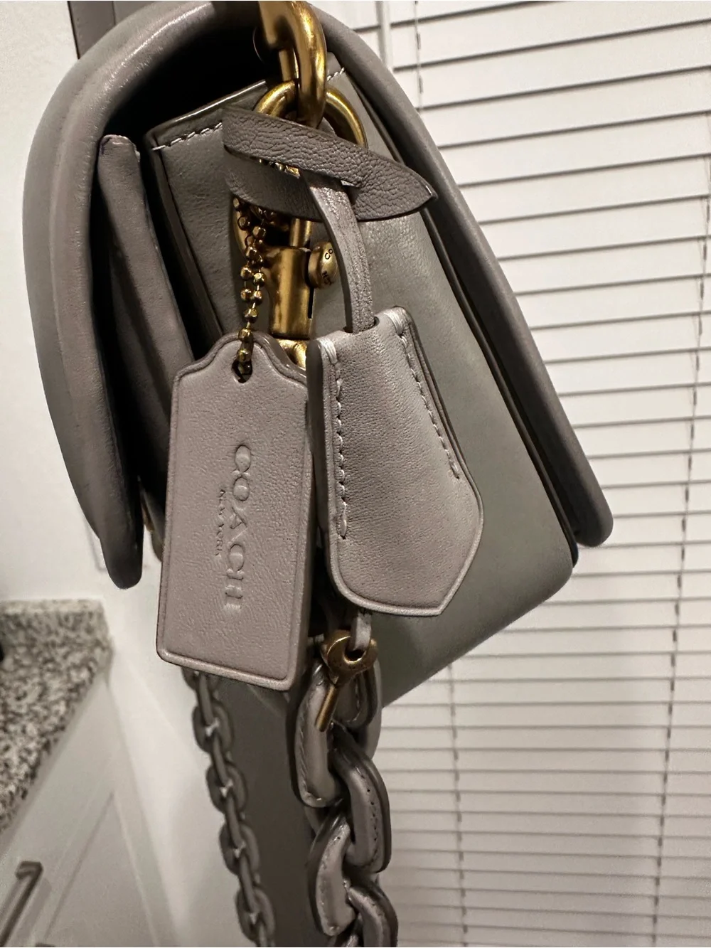 Coach compact quilted